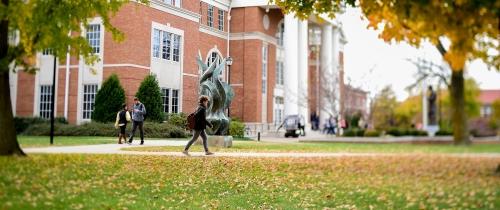 Centre College students walking outside on their way to class during fall